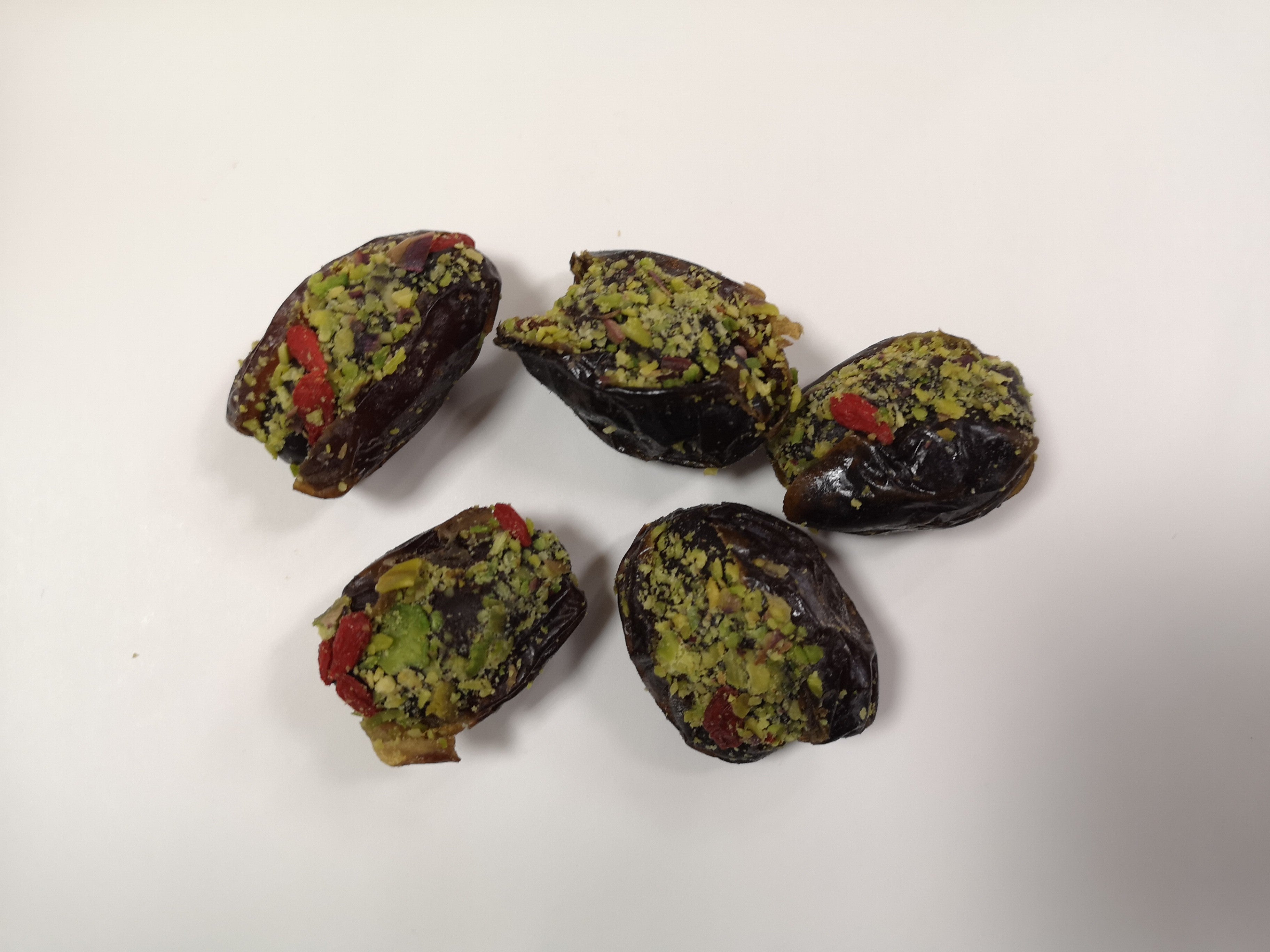Dates with pistachio cream, pistachios, and goji berries